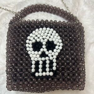 Beaded purple and white Halloween skull purse with chain as the handle